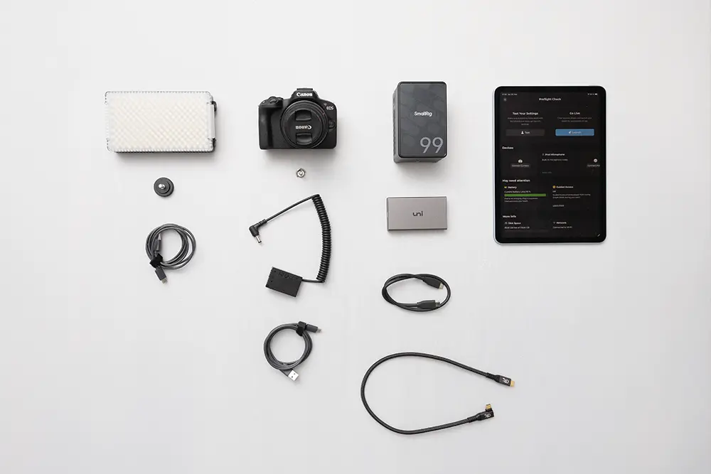 All the key gear for the DIY photo booth roamer—iPad, camera, light, power, and cables. Overview of hardware setup
